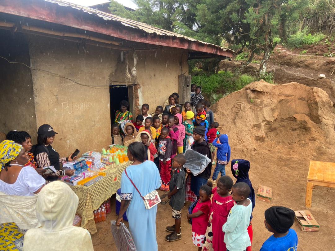 Distributing school supplies and refreshments to orphans